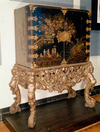 Black and gold lacquer cabinet on carved and silvered stand, Charles II period, 1649-85 by English School